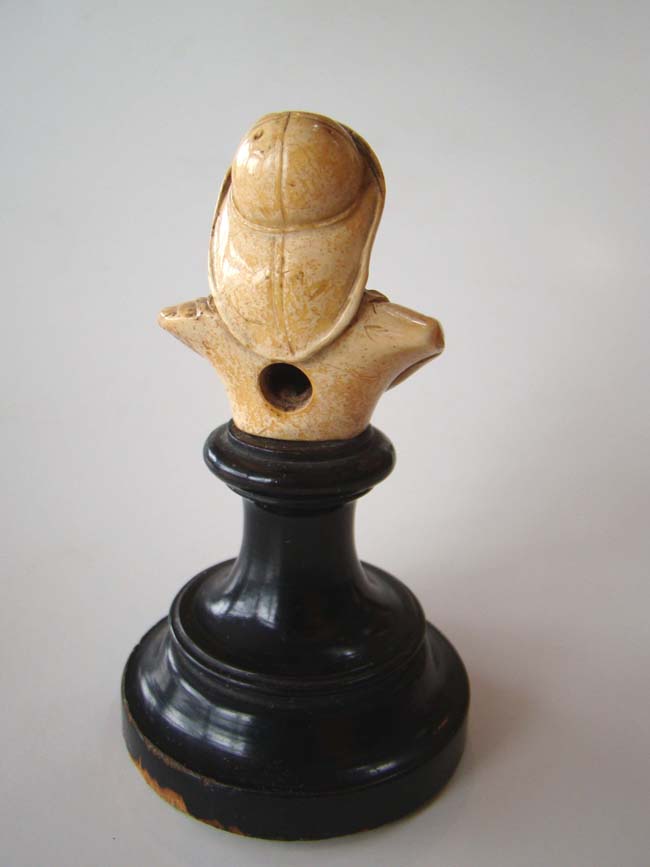 A small and charming ivory or bone bust of a fisherman mounted on a stand circa 1880 — image 3
